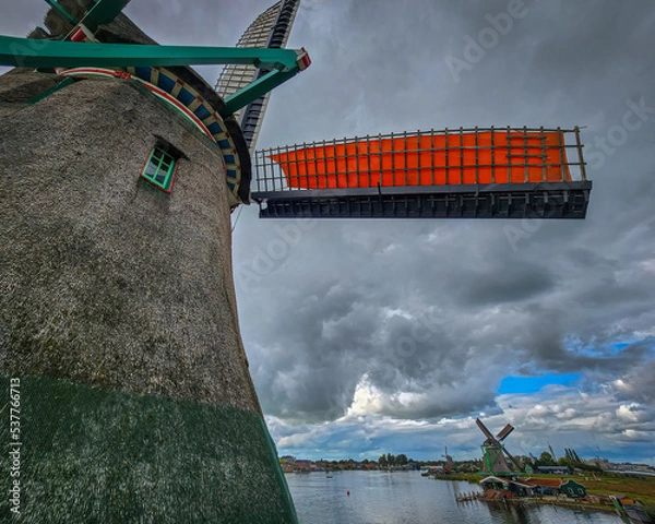 Obraz Windmills in Zaanse Schans in the Netherlands with reflections over the water