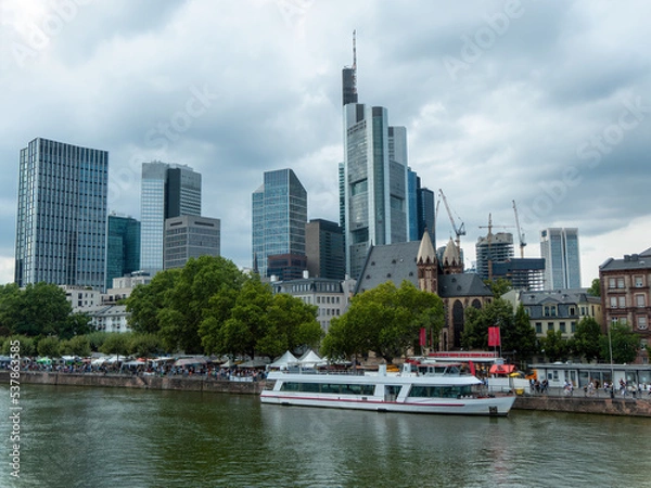 Fototapeta View of the Frankfurt skyline at the Museum Embankment Festival with the River Main and ships