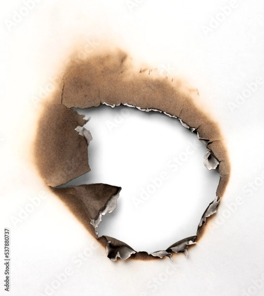 Fototapeta Close-Up View of a Burnt Hole in a Paper