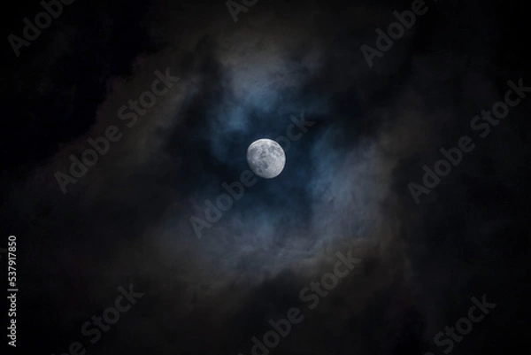 Fototapeta Almost full moon in clouds
