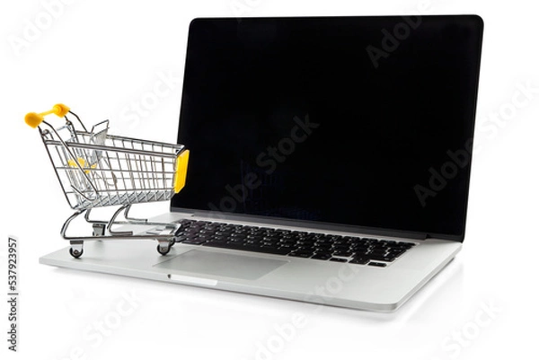 Obraz E-commerce. Shopping cart on laptop. Conceptual image.
