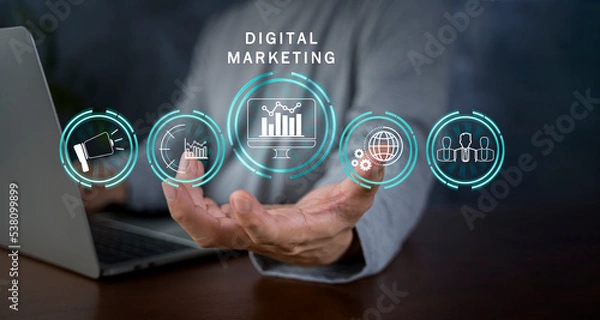 Fototapeta Hand shows the sign and icon of Digital marketing internet advertising and sales increase business technology concept, online marketing, E-business