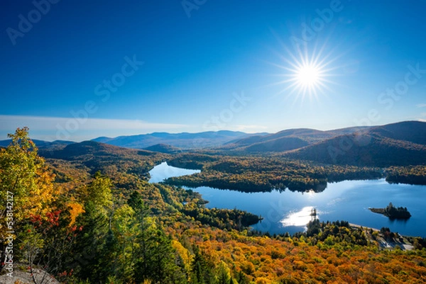 Fototapeta High angle view of a beautiful autumn lake and forest in a national park in Canada.