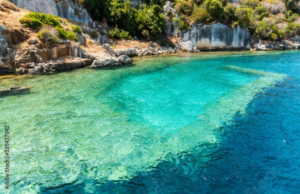 Fototapeta Coast of Kekova island with visible underwater structures of the Sunken City, in Antalya Province of Turkey