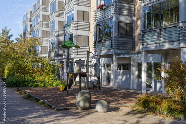 Obraz Residential building with playground. Real estate investment. Expensive housing.