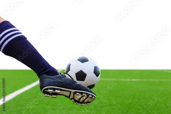 Fototapeta foot kicking soccer ball isolated with clipping path