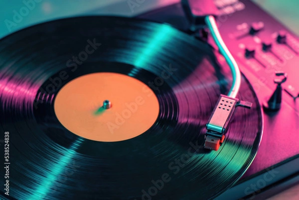 Fototapeta View on vintage vinyl record player playing sound from LP album.