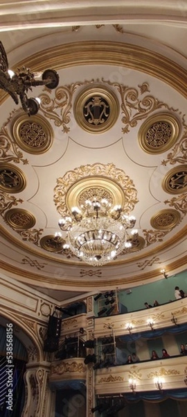 Fototapeta The ceiling in the theater. A large chandelier. Theater in Irkutsk.
