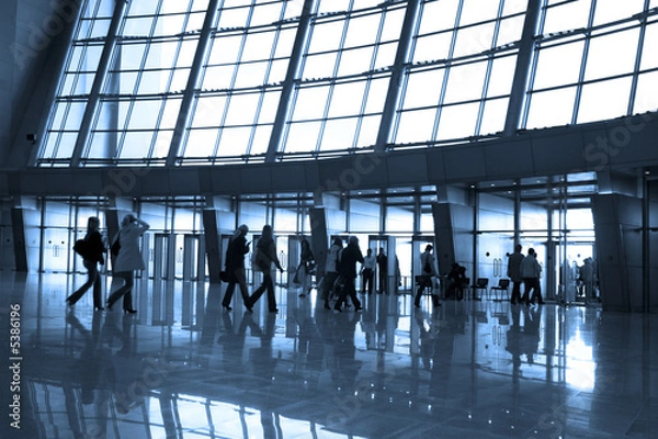 Fototapeta People silhouettes at airport building