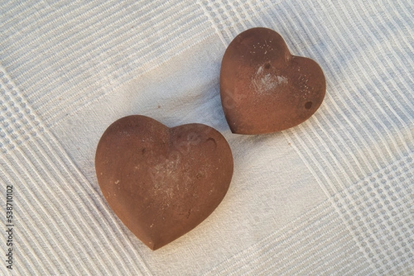 Obraz stone hearts on white fabric background