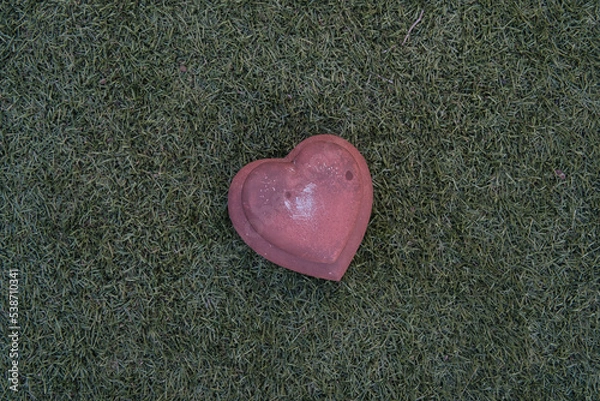 Fototapeta stone hearts on grass background