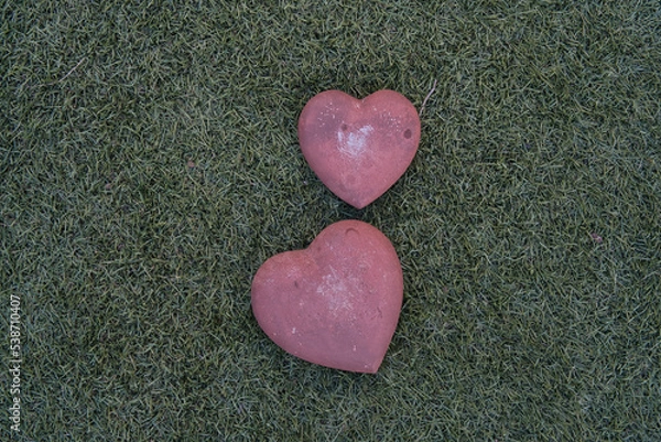 Obraz stone hearts on grass background