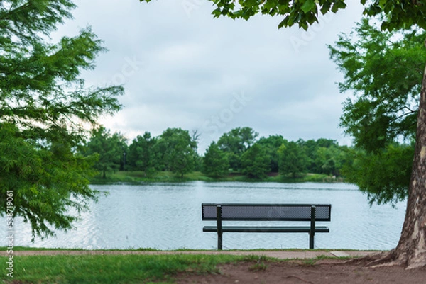 Obraz park bench by the lake