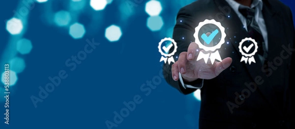 Fototapeta Businessman hands touching the icon. quality assurance Company product quality certificate Comply with the ISO Certification and standardization, standard concept, satisfaction, service experience.