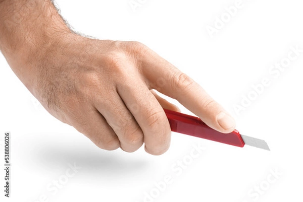 Fototapeta Man with red utility knife on white background