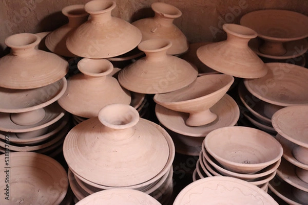 Fototapeta Ceramic bowls and containers without painting, only with the mud clay