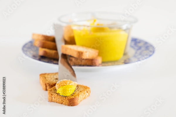 Fototapeta Slice of bread with fresh hummus dip