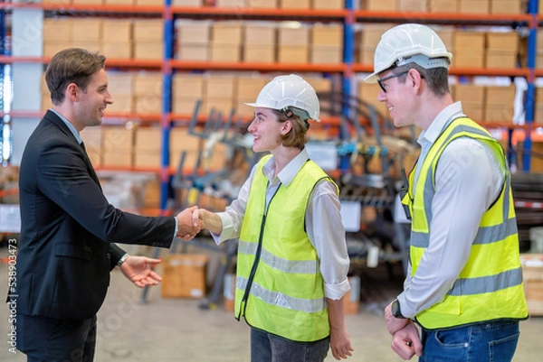Obraz manager visit staff in storage warehouse and have some discussion with site team appreciated and congratulation check hand