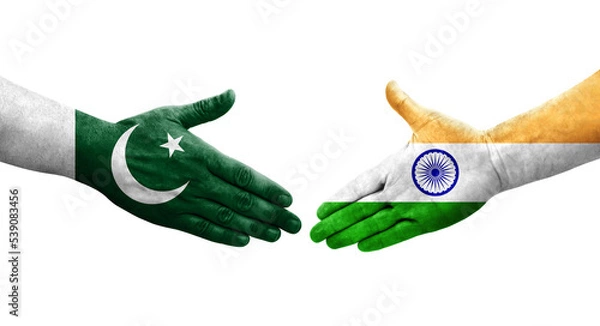 Fototapeta Handshake between India and Pakistan flags painted on hands, isolated transparent image.