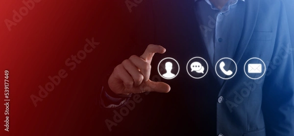 Fototapeta Businessman hand holding,pressing on icon phone, mail, telephone,message,post and person,user. Customer service call center contact us concept.Banner,copy space.Contact Methods.