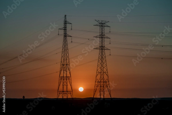 Obraz Por do sol e torres de energia