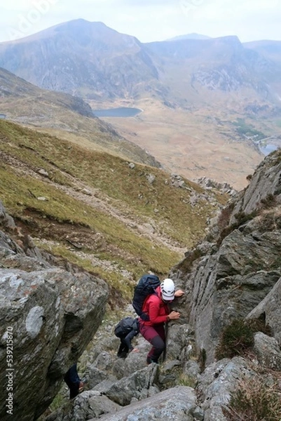 Fototapeta Scotland, Snowdonia. Hiking and climbing ridges through the wilderness during Spring time. Some days are sunny some days are rainy, but all of them are an adventure
