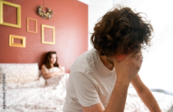 Fototapeta Handsome man disappointed himself that his girlfriend get disappointed because of a premature ejaculation and erectile problem. Guy lost confidence with unhappy and unsatisfied wife. 