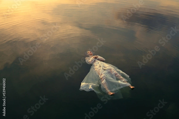 Fototapeta Dead Ophelia in lake waters at sunset