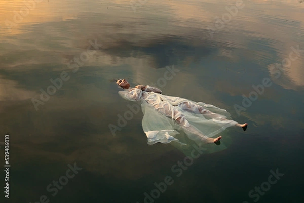 Obraz Floating dead bride in sunset colored waters