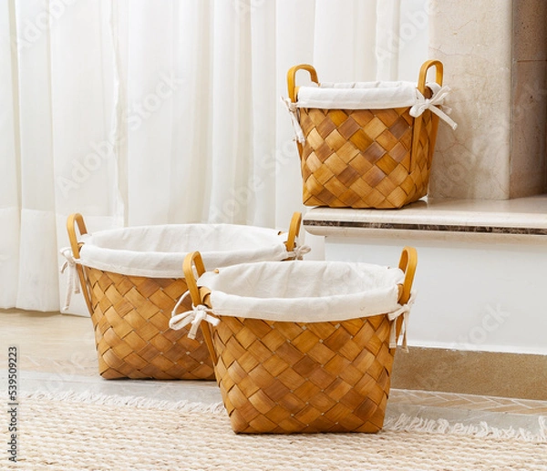 Obraz 3 wicker baskets in a living room setting