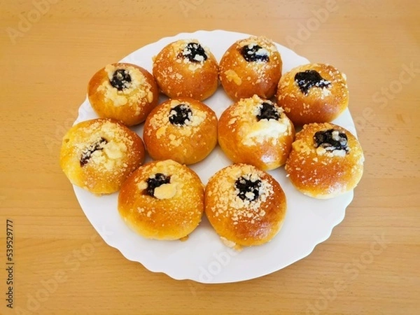 Fototapeta Cakes baked, with jam and cottage cheese, placed on a white plate