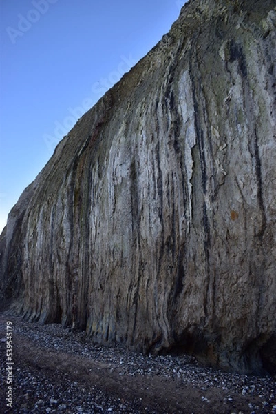 Fototapeta Nature background.  Soft focus of geological structure, landslide on steep coastal cliffs 