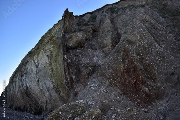 Fototapeta Nature background.  Soft focus of geological structure, landslide on steep coastal cliffs 