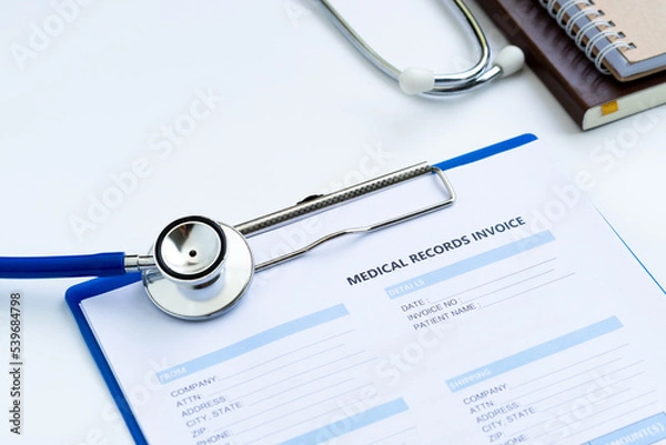 Fototapeta Stethoscope with medical records invoice. on white background.