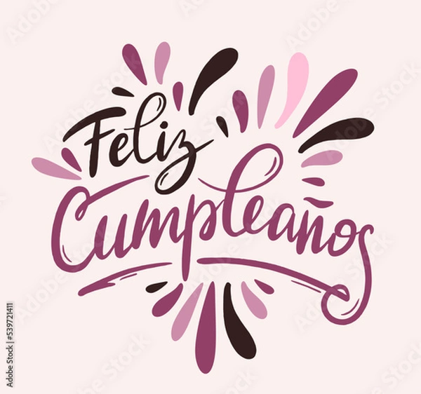 Fototapeta Happy birthday in Spain.  Lettering in Spanish with splashes and curls. Vector illustration