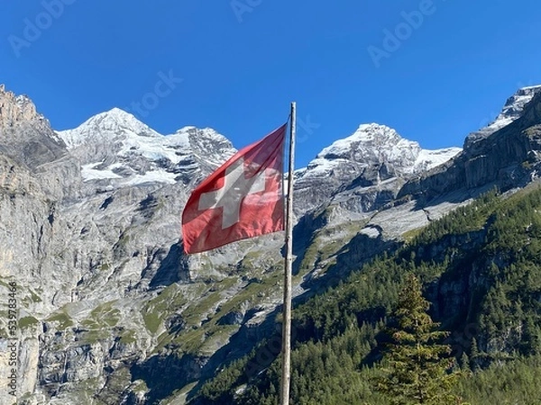 Obraz Summer day blue sky mountains landscape. Nature landscape with sun and blue sky. Summer travel in Europe mountains. Nature, lake, forest, trees hiking path. Clouds on blue sky. Forest landscape hiking