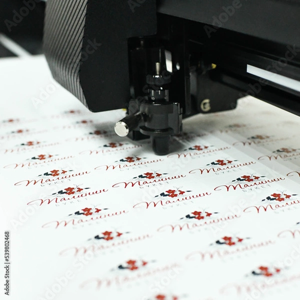 Obraz plotter cutting stickers typography polygraphy machine black labels contour cutting
