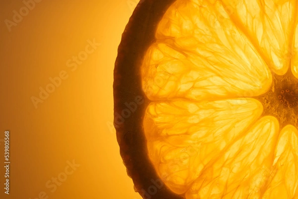 Fototapeta Slice of fresh juicy orange fruit close up on orange background. Macro photography concept. 