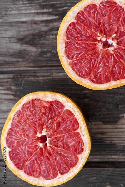 Fototapeta red grapefruit on old table