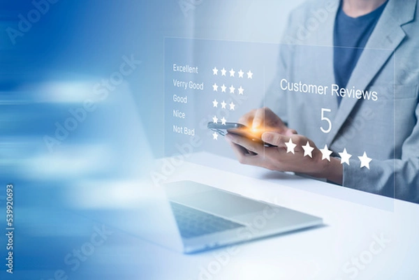 Fototapeta Satisfaction and customer service survey concept, business people using  laptop and smartphone. to answer the questionnaire And the satisfaction rating, the satisfaction rating with the icon 5 stars.
