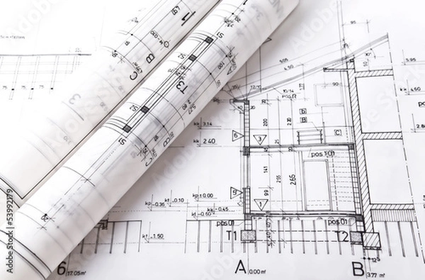 Fototapeta Architect rolls and plans project blueprint