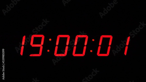 Fototapeta Digital timer on a black background. Light panel with red numbers