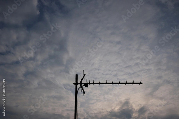 Obraz antenna on a cloudy sky
