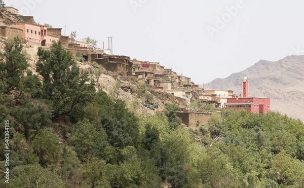 Fototapeta ancient village, castle on hills, in the Moroccan mountains, beautiful nature, large valleys, historical ruins, sublime architecture built by natural means, stone and sand.