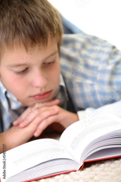 Fototapeta Boy learning on the floor.