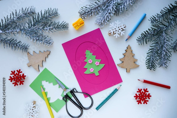 Fototapeta making greeting cards for christmas and new year. Children's DIY concept. Handmade crafts on holiday