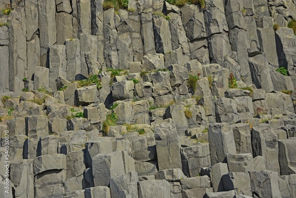 Fototapeta Basalt columns on Reynisfjara black volcanic sand beach in iceland by the ocean