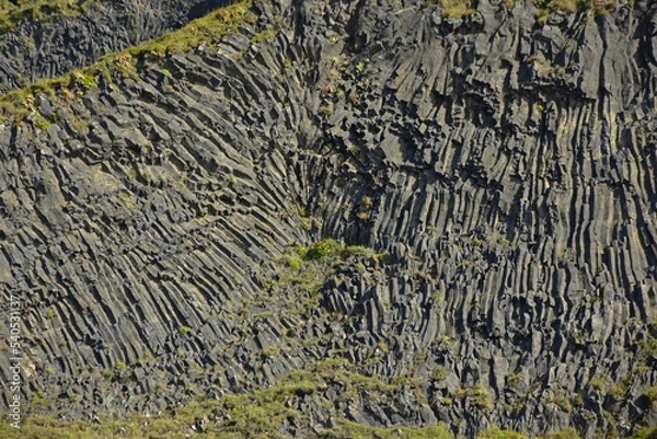 Fototapeta Basalt columns on Reynisfjara black volcanic sand beach in iceland by the ocean