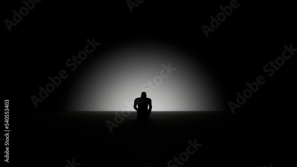 Fototapeta depressed silhouette of a man sitting in the dark