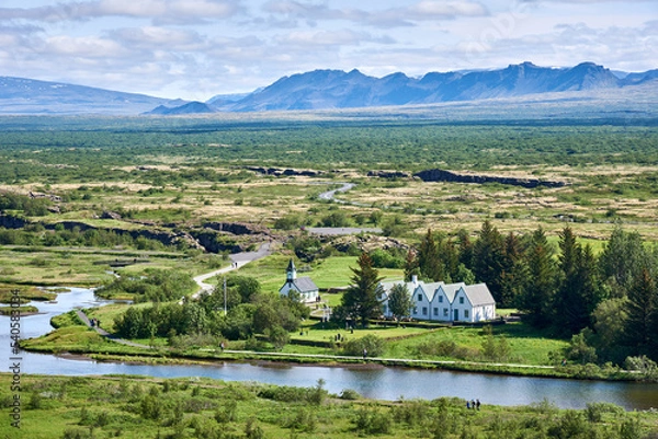 Obraz View of Thingvellir National Park, Iceland showing Thingvellir Church and Thingvellir House on the Oxara River.